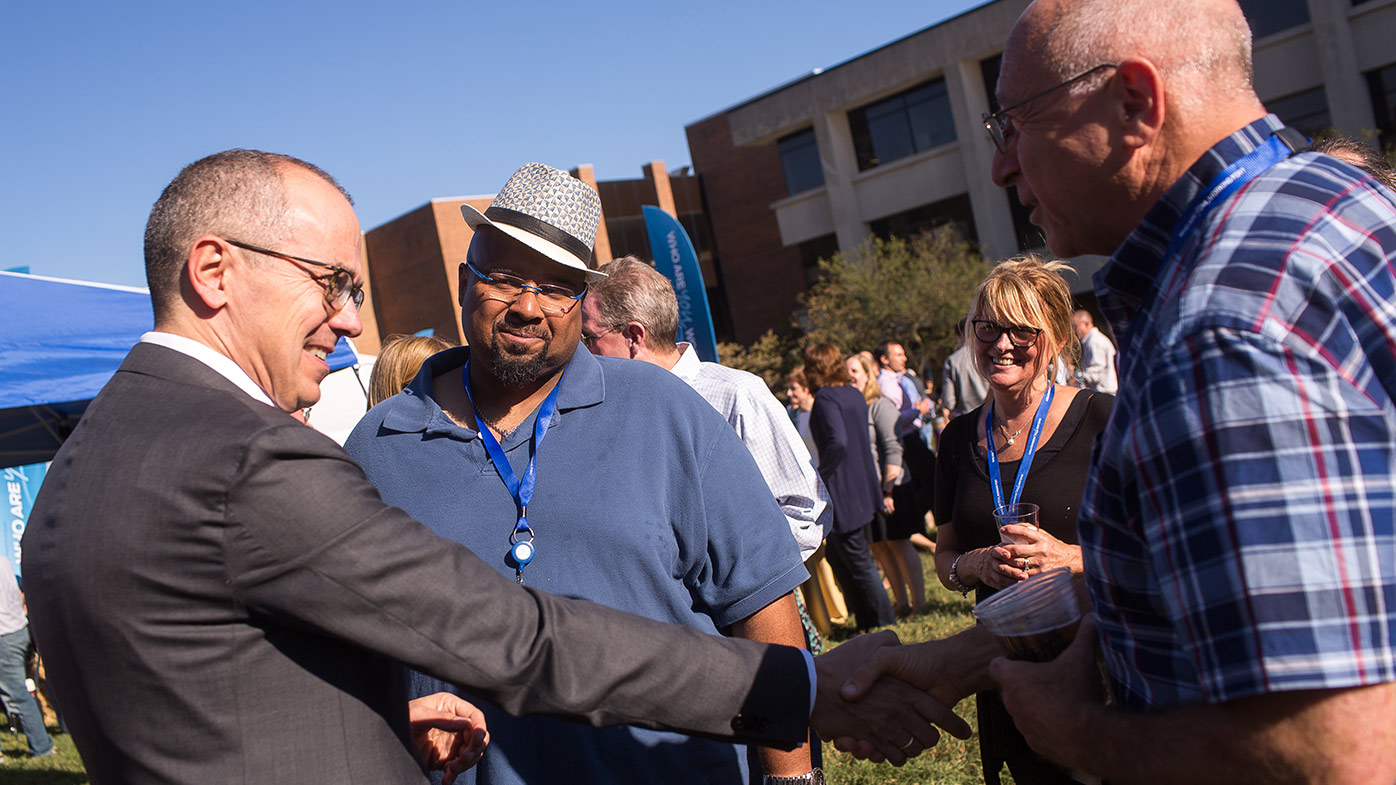 Patients share a moment with CEO Giovanni Caforio during a past Global Patient Week employee celebration in New Jersey. 