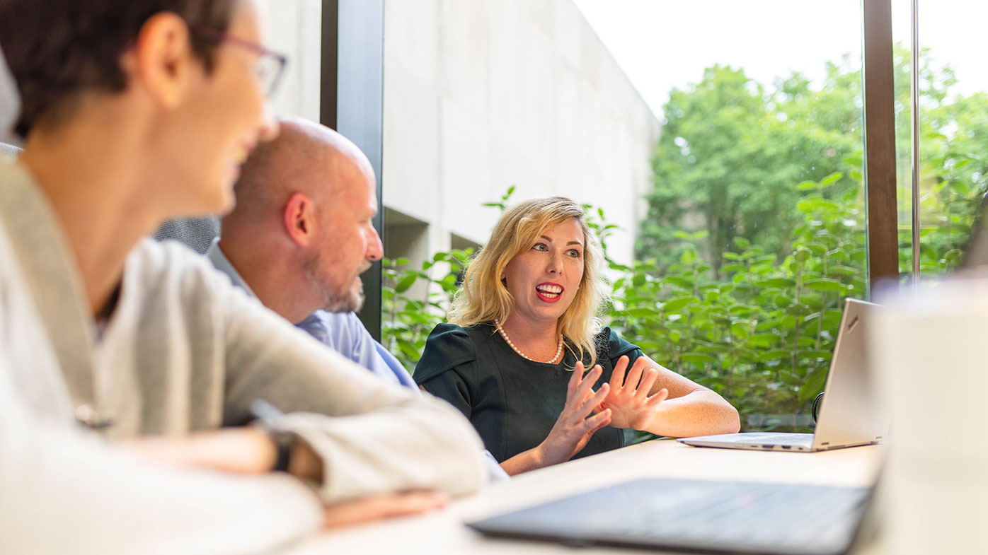 Julie Meade, PhD, scientific writer, Global Scientific and Regulatory Documentation, collaborates with colleagues in her role at Bristol Myers Squibb