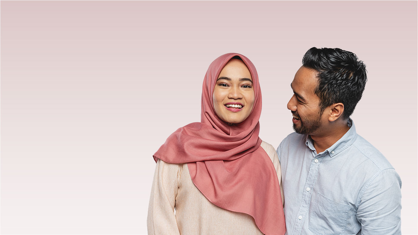 Smiling man standing next to a smiling woman